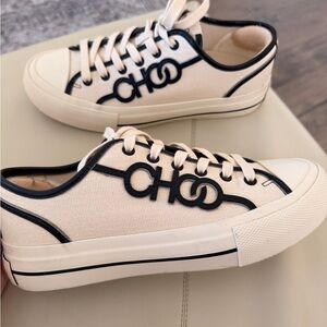 Jimmy Choo Cream and Black Athletic Shoes